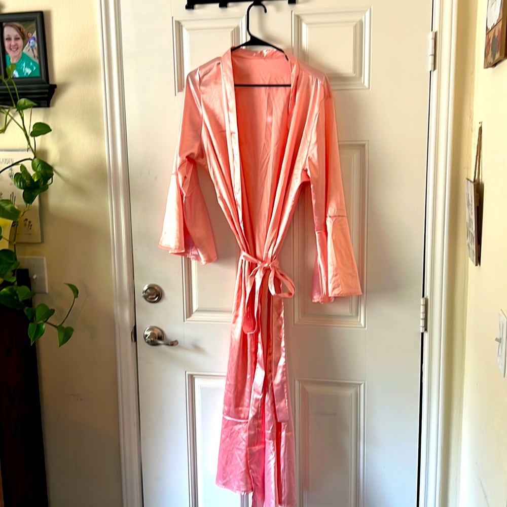 Pink silly looking with flair sleeves and long belt beautiful when ironed